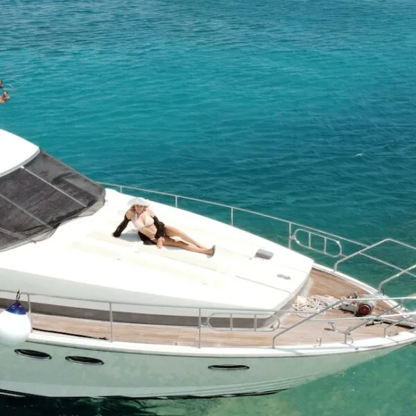 A yacht with some people in the sea