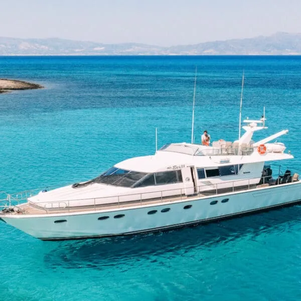 A yacht in bluegreen waters north of Chrissi Island in Crete