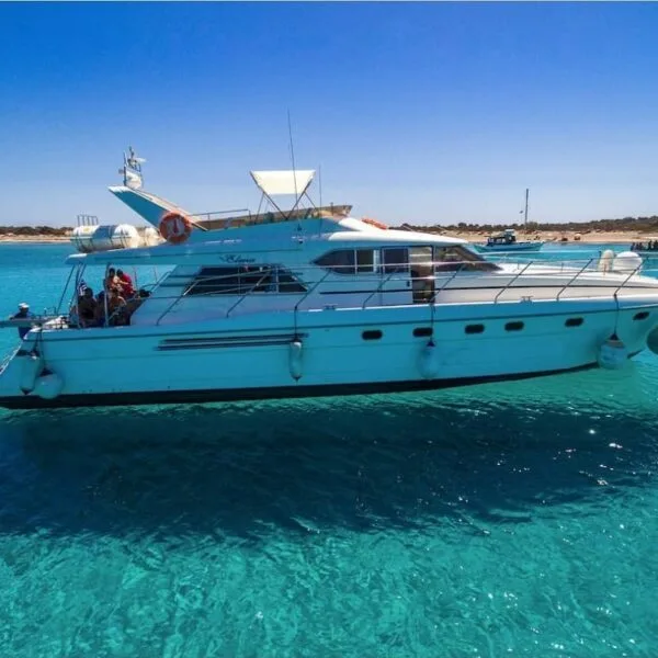 A yacht in the crystal clear blue sea on the south side of Chrissi Island in Southern Crete