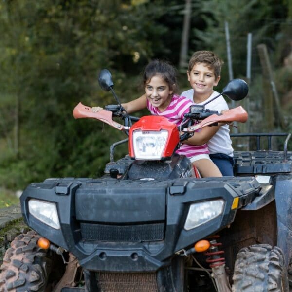 Two kids on a ATV Quad